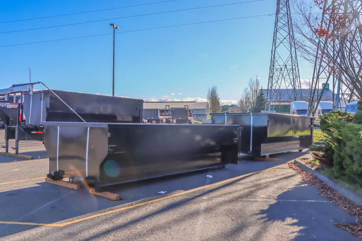 Roll-off dumpster ready for waste disposal at job site for Demolition Dumpster Rental in Lansing